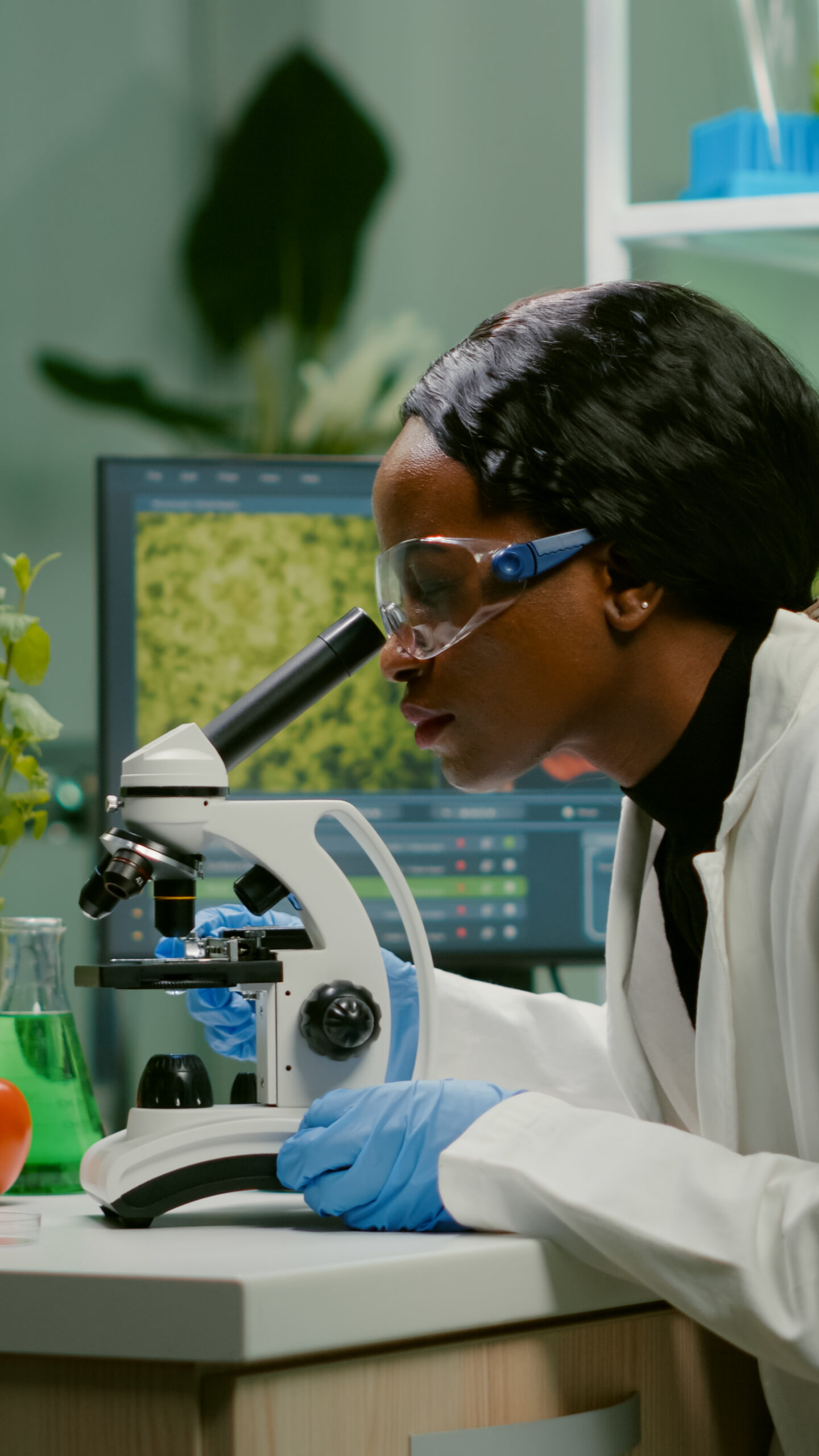 hero-img-02 Biologist Woman Examining Biological Slide Medical Expertise Using Microscope Scaled